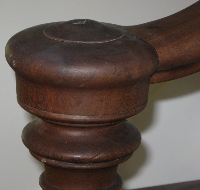 Antique newel post joined with a new custom stained handrail.