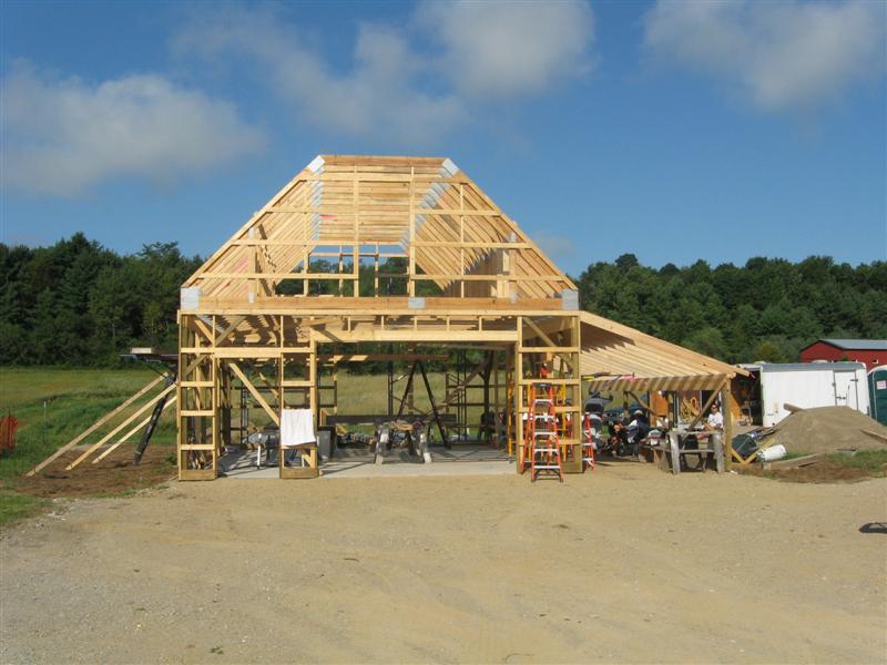 Attic trusses in this new barn will provide ample storage.