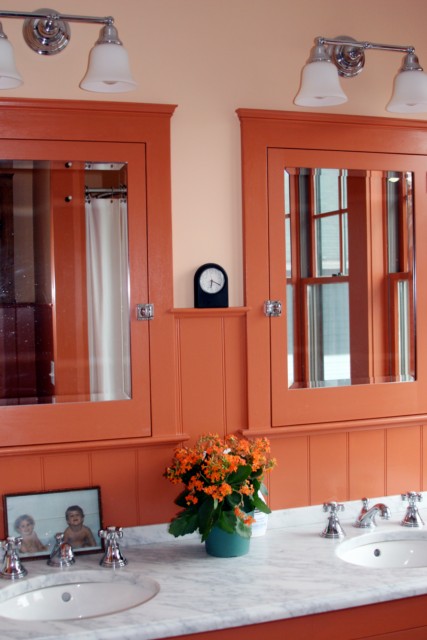 Custom built-in bath/medicine cabinets with indigenous Cararra marble counter & double sinks.